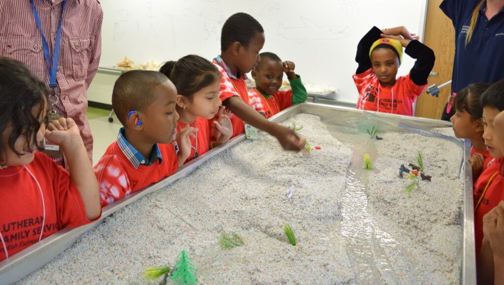 Children using an Emriver Em2 Stream Table