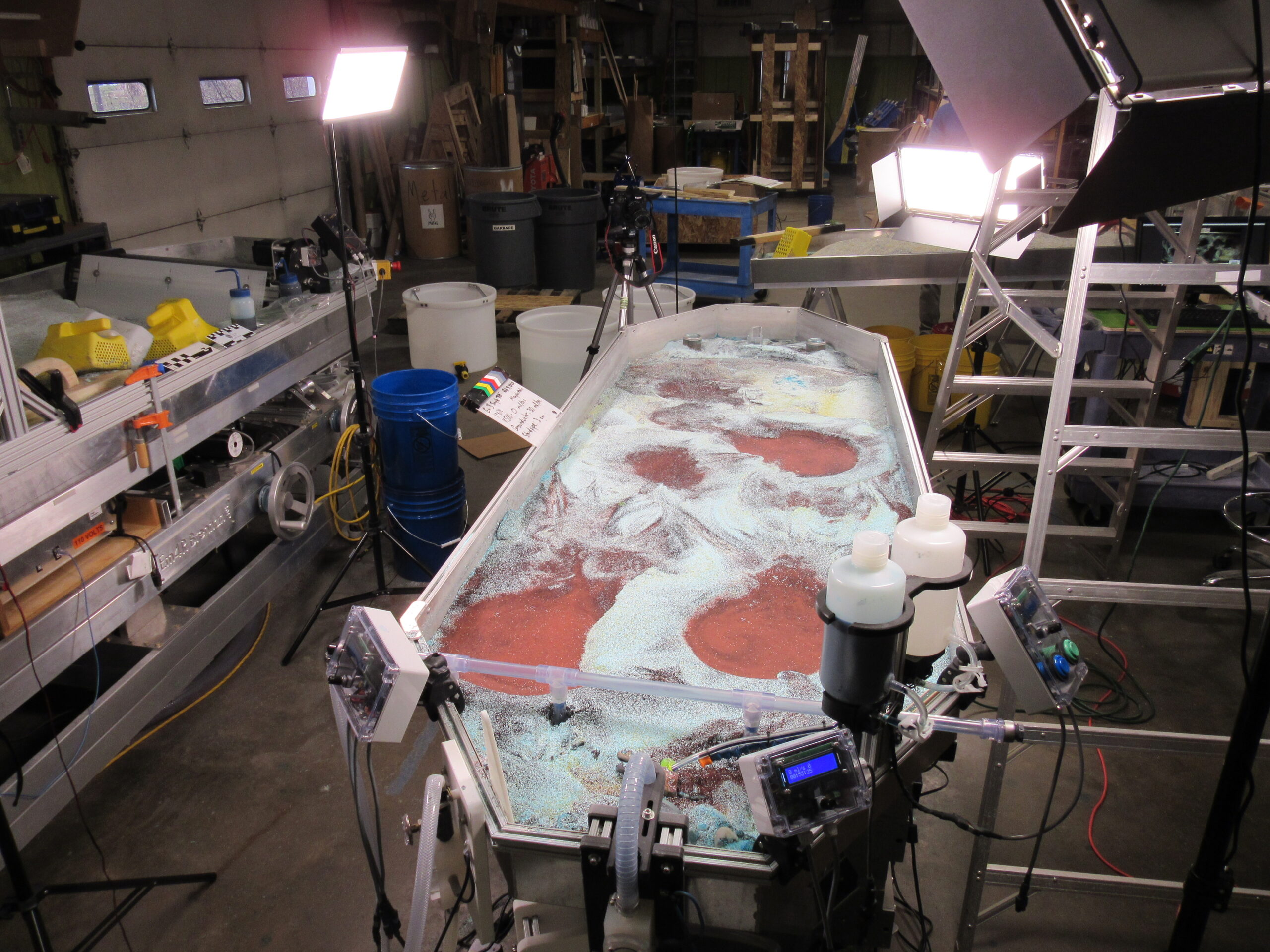 photo of stream table set up with lights for filming